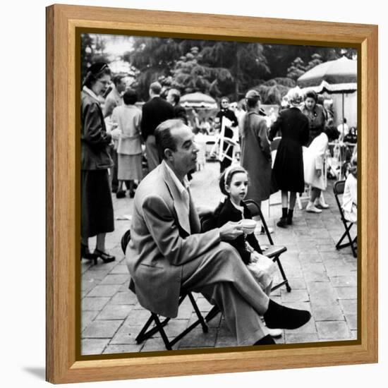 Vincente Minnelli with coffee sitting in chair with Daughter Liza at Outdoor Children's Party Being-J^ R^ Eyerman-Framed Premier Image Canvas