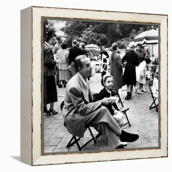 Vincente Minnelli with coffee sitting in chair with Daughter Liza at Outdoor Children's Party Being-J^ R^ Eyerman-Framed Premier Image Canvas