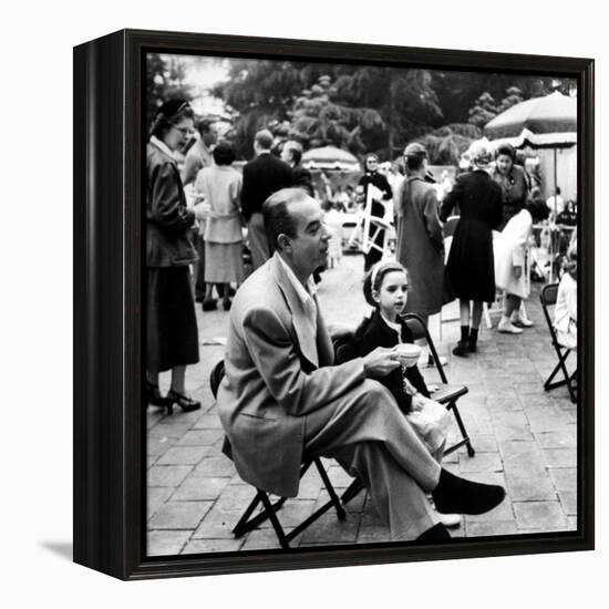 Vincente Minnelli with coffee sitting in chair with Daughter Liza at Outdoor Children's Party Being-J^ R^ Eyerman-Framed Premier Image Canvas