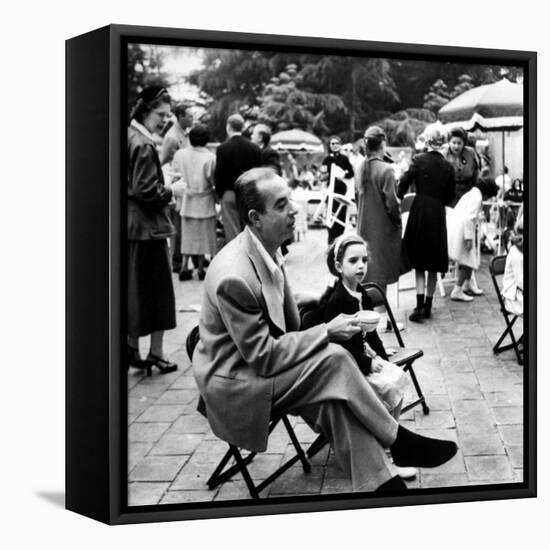 Vincente Minnelli with coffee sitting in chair with Daughter Liza at Outdoor Children's Party Being-J^ R^ Eyerman-Framed Premier Image Canvas