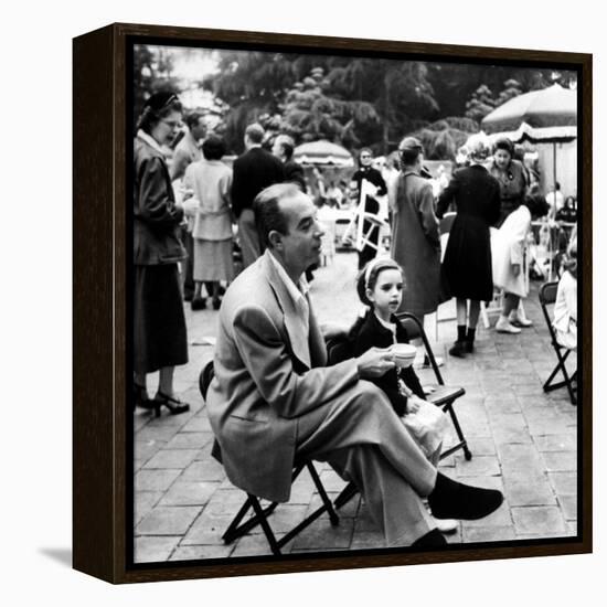 Vincente Minnelli with coffee sitting in chair with Daughter Liza at Outdoor Children's Party Being-J^ R^ Eyerman-Framed Premier Image Canvas