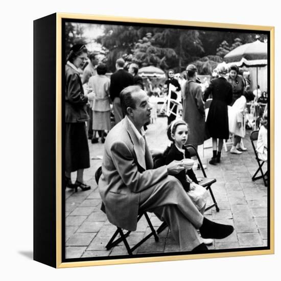 Vincente Minnelli with coffee sitting in chair with Daughter Liza at Outdoor Children's Party Being-J^ R^ Eyerman-Framed Premier Image Canvas