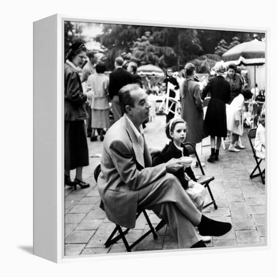 Vincente Minnelli with coffee sitting in chair with Daughter Liza at Outdoor Children's Party Being-J^ R^ Eyerman-Framed Premier Image Canvas