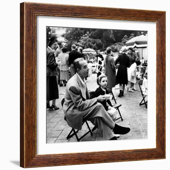 Vincente Minnelli with coffee sitting in chair with Daughter Liza at Outdoor Children's Party Being-J^ R^ Eyerman-Framed Premium Photographic Print