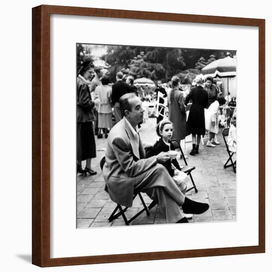 Vincente Minnelli with coffee sitting in chair with Daughter Liza at Outdoor Children's Party Being-J^ R^ Eyerman-Framed Premium Photographic Print