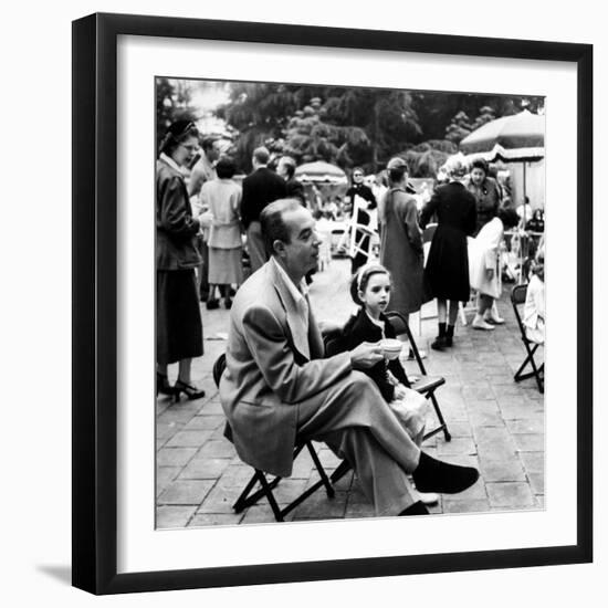 Vincente Minnelli with coffee sitting in chair with Daughter Liza at Outdoor Children's Party Being-J^ R^ Eyerman-Framed Premium Photographic Print