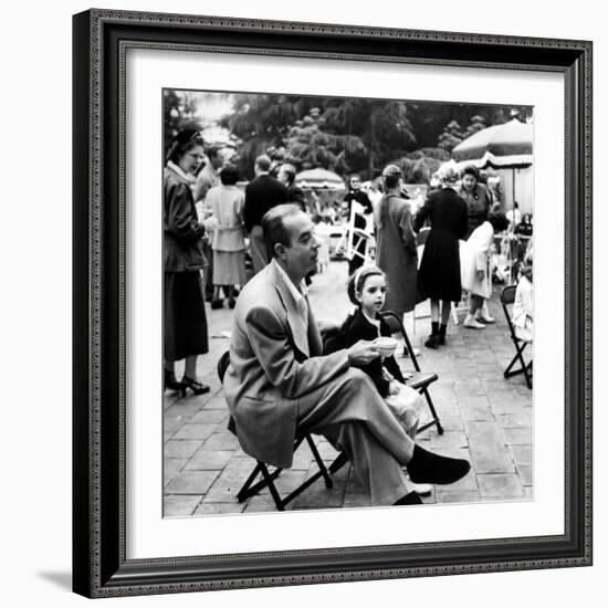 Vincente Minnelli with coffee sitting in chair with Daughter Liza at Outdoor Children's Party Being-J^ R^ Eyerman-Framed Premium Photographic Print