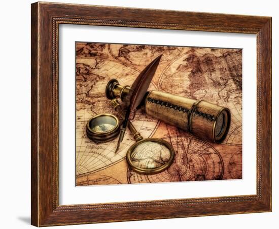 Vintage Magnifying Glass, Compass, Goose Quill Pen And Spyglass Lying On An Old Map-Andrey Armyagov-Framed Art Print