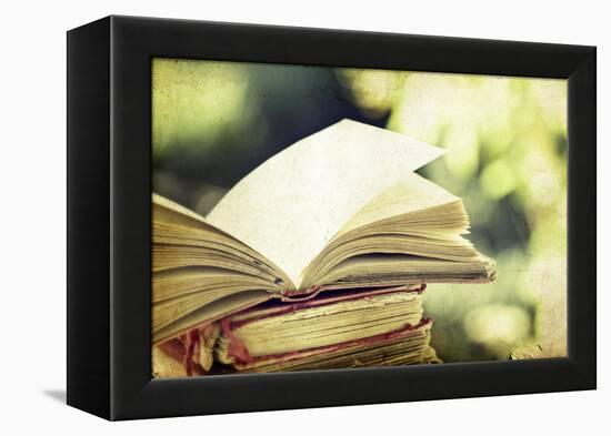 Vintage Photo of Old Books on Colorful Bokeh Background-melis-Framed Premier Image Canvas