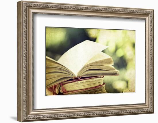 Vintage Photo of Old Books on Colorful Bokeh Background-melis-Framed Photographic Print