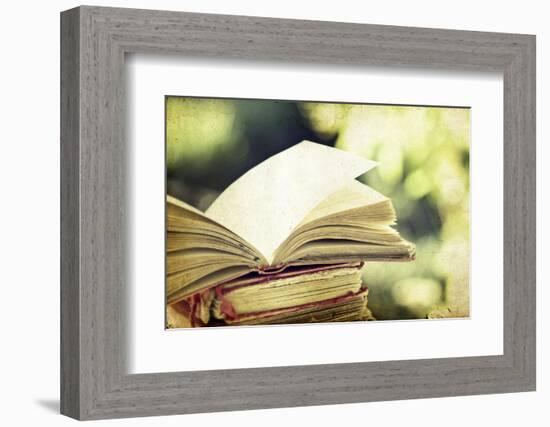 Vintage Photo of Old Books on Colorful Bokeh Background-melis-Framed Photographic Print