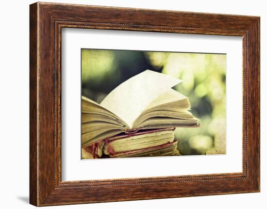 Vintage Photo of Old Books on Colorful Bokeh Background-melis-Framed Photographic Print