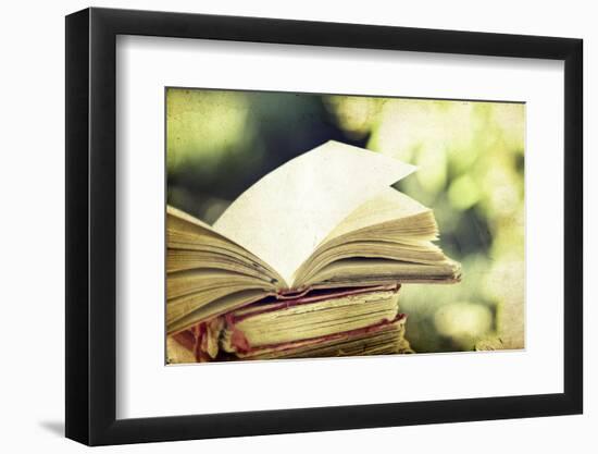 Vintage Photo of Old Books on Colorful Bokeh Background-melis-Framed Photographic Print