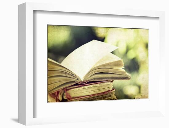 Vintage Photo of Old Books on Colorful Bokeh Background-melis-Framed Photographic Print