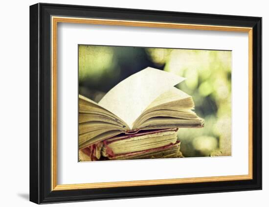 Vintage Photo of Old Books on Colorful Bokeh Background-melis-Framed Photographic Print
