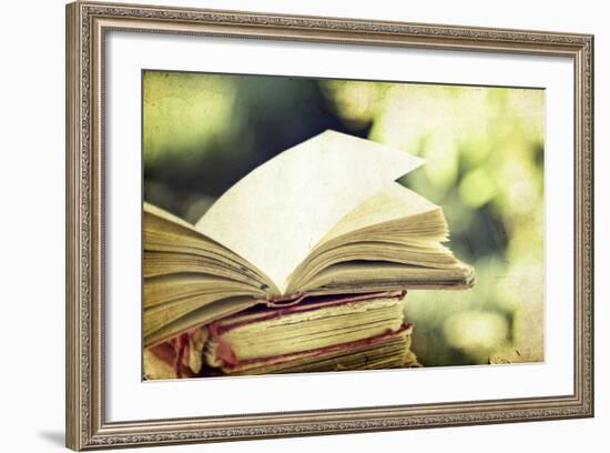 Vintage Photo of Old Books on Colorful Bokeh Background-melis-Framed Photographic Print