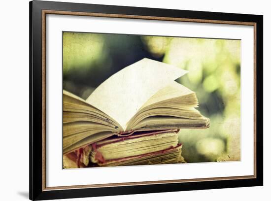 Vintage Photo of Old Books on Colorful Bokeh Background-melis-Framed Photographic Print