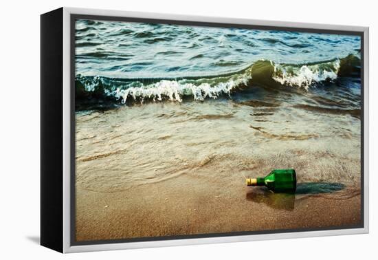 Vintage Retro Hipster Style Travel Image of Message Bottle on Beach Sand in Waves-f9photos-Framed Premier Image Canvas