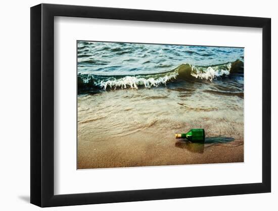 Vintage Retro Hipster Style Travel Image of Message Bottle on Beach Sand in Waves-f9photos-Framed Photographic Print