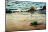 Vintage Retro Hipster Style Travel Image of Message Bottle on Beach Sand in Waves-f9photos-Mounted Photographic Print
