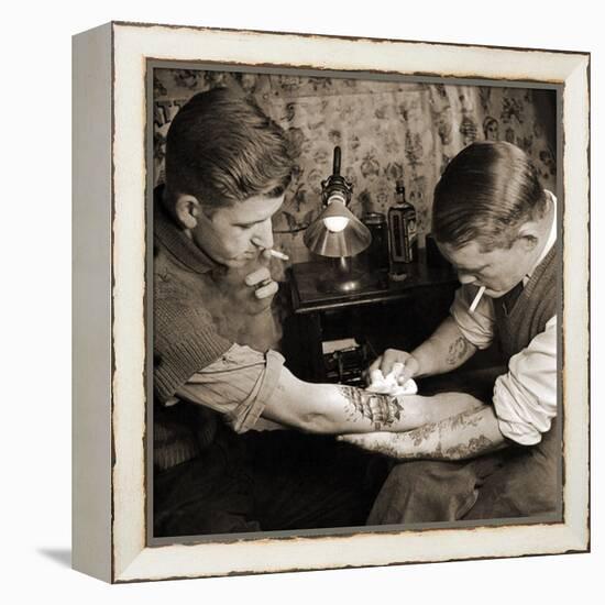 Vintage Shot of a Man Being Tattooed-null-Framed Premier Image Canvas