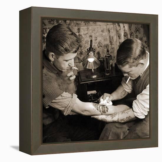 Vintage Shot of a Man Being Tattooed-null-Framed Premier Image Canvas