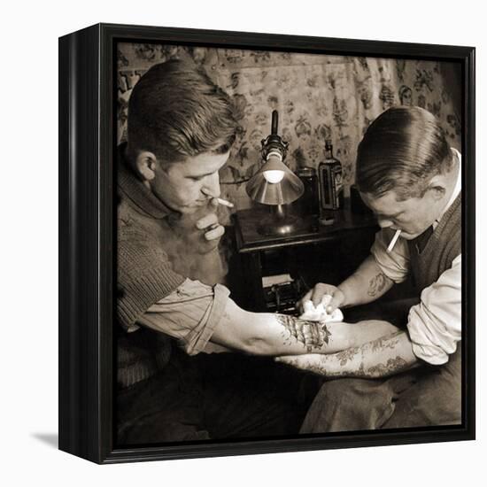 Vintage Shot of a Man Being Tattooed-null-Framed Premier Image Canvas