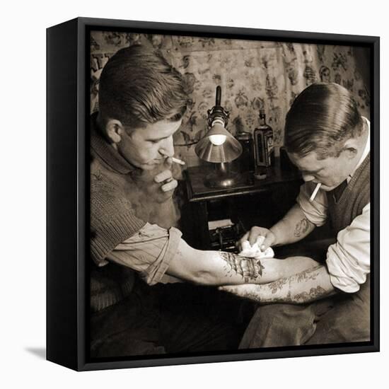 Vintage Shot of a Man Being Tattooed-null-Framed Premier Image Canvas