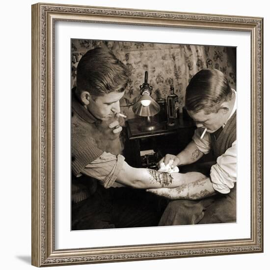 Vintage Shot of a Man Being Tattooed-null-Framed Photographic Print