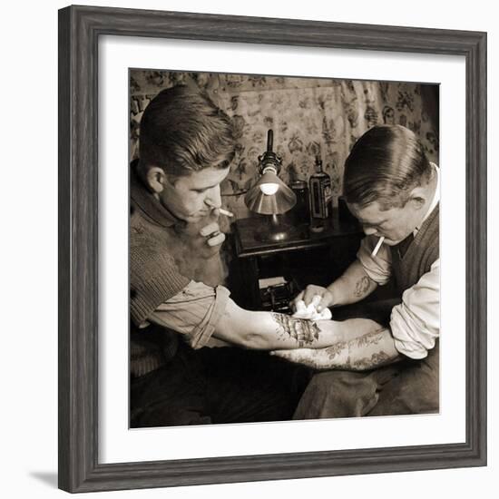 Vintage Shot of a Man Being Tattooed-null-Framed Photographic Print