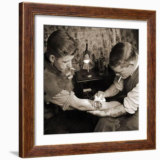 Vintage Shot of a Man Being Tattooed-null-Framed Photographic Print