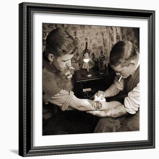 Vintage Shot of a Man Being Tattooed-null-Framed Photographic Print