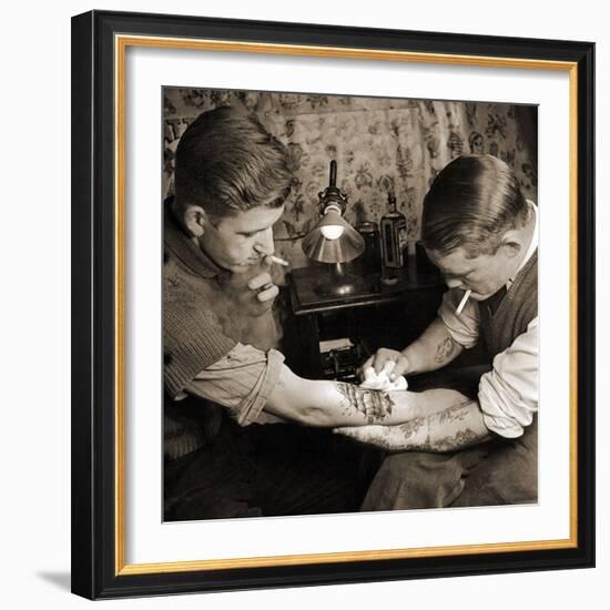 Vintage Shot of a Man Being Tattooed-null-Framed Photographic Print