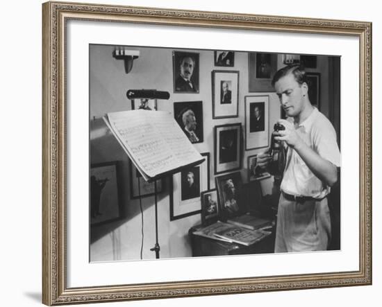 Violinist Yehudi Menuhin, 20, Tuning His Violin, Prepares to Practice the Schumann Violin Concerto-Horace Bristol-Framed Premium Photographic Print