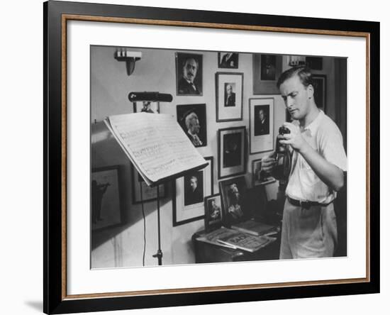 Violinist Yehudi Menuhin, 20, Tuning His Violin, Prepares to Practice the Schumann Violin Concerto-Horace Bristol-Framed Premium Photographic Print