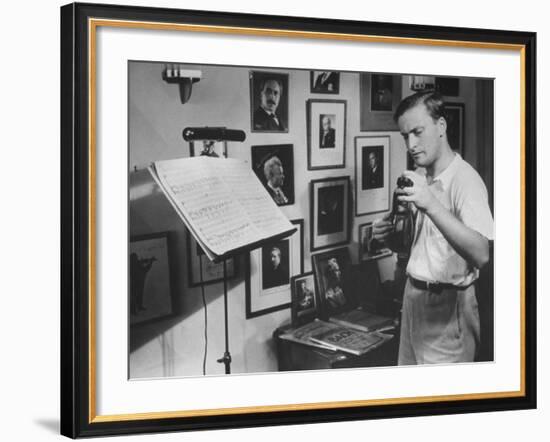 Violinist Yehudi Menuhin, 20, Tuning His Violin, Prepares to Practice the Schumann Violin Concerto-Horace Bristol-Framed Premium Photographic Print