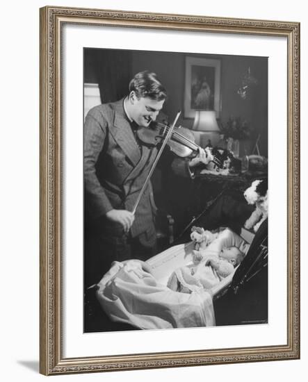 Violinist Yehudi Menuhin, Playing the Violin for His New Baby Daughter in Hotel Room-Hansel Mieth-Framed Premium Photographic Print