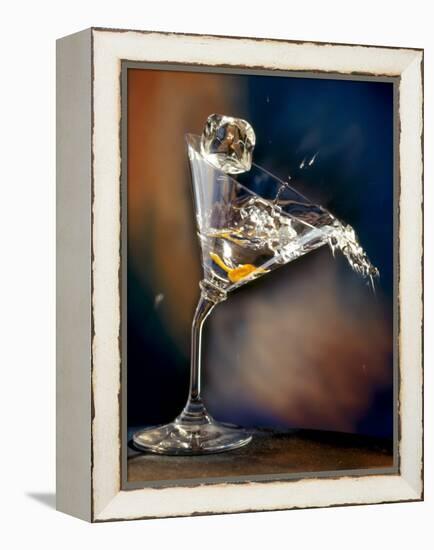 Vodka Martini Spilling from a Bent Martini Glass with Ice Cube-Jeff Sarpa-Framed Premier Image Canvas