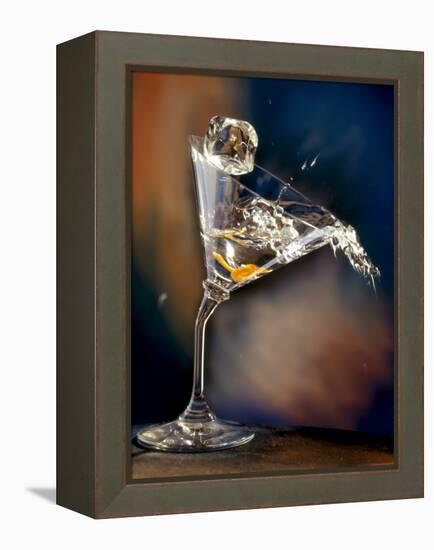 Vodka Martini Spilling from a Bent Martini Glass with Ice Cube-Jeff Sarpa-Framed Premier Image Canvas