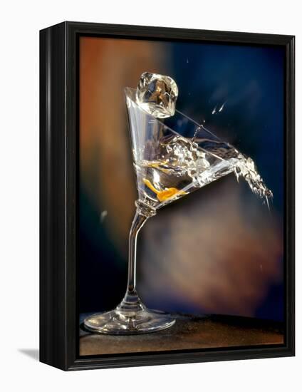 Vodka Martini Spilling from a Bent Martini Glass with Ice Cube-Jeff Sarpa-Framed Premier Image Canvas