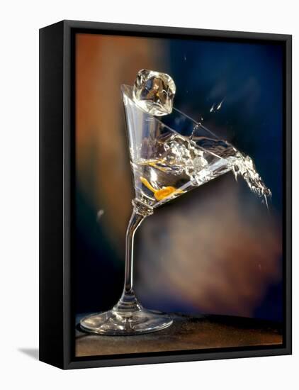 Vodka Martini Spilling from a Bent Martini Glass with Ice Cube-Jeff Sarpa-Framed Premier Image Canvas