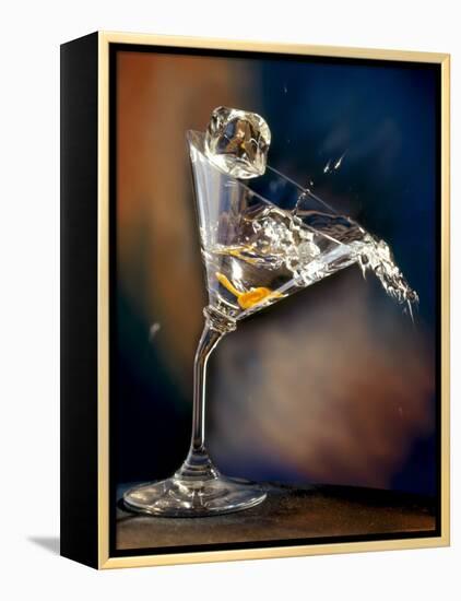 Vodka Martini Spilling from a Bent Martini Glass with Ice Cube-Jeff Sarpa-Framed Premier Image Canvas