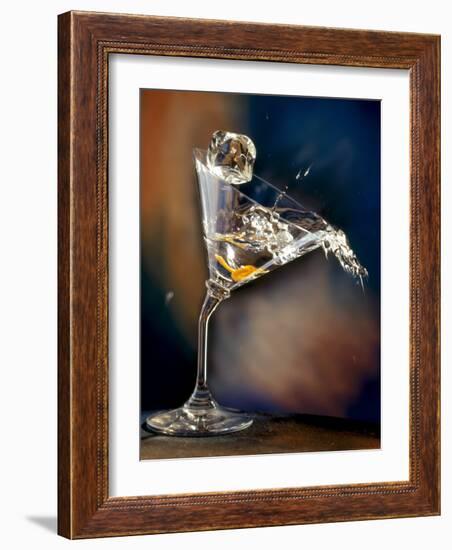 Vodka Martini Spilling from a Bent Martini Glass with Ice Cube-Jeff Sarpa-Framed Photographic Print