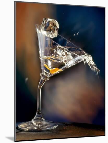 Vodka Martini Spilling from a Bent Martini Glass with Ice Cube-Jeff Sarpa-Mounted Photographic Print