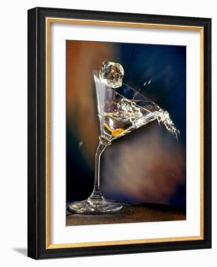 Vodka Martini Spilling from a Bent Martini Glass with Ice Cube-Jeff Sarpa-Framed Photographic Print
