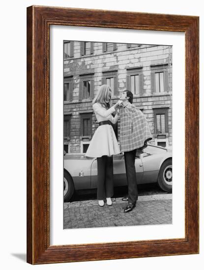 Vogue - April 1969 - Veruschka Adjusts Tomas Milian's Cape-Franco Rubartelli-Framed Premium Photographic Print
