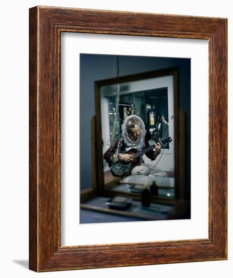 Volunteer Wearing Plastic Helmet Plays a Steel Guitar for Nih Expericment, Bethesda, Maryland, 1958-Yale Joel-Framed Photographic Print