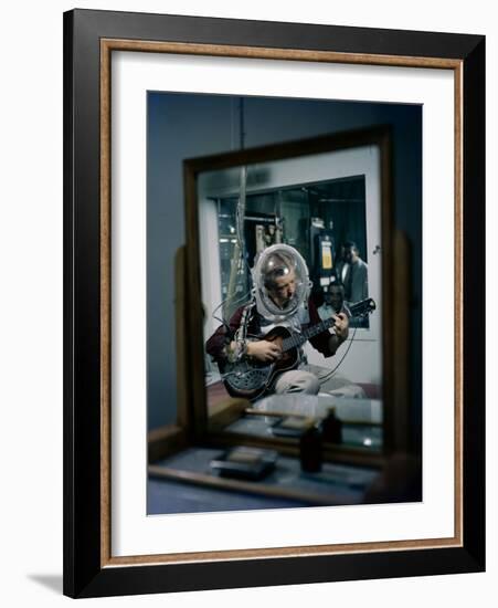 Volunteer Wearing Plastic Helmet Plays a Steel Guitar for Nih Expericment, Bethesda, Maryland, 1958-Yale Joel-Framed Photographic Print