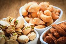 Varieties of Nuts: Cashew, Pistachio, Almond.-Voy-Photographic Print