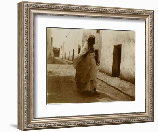 Voyage en Algérie : femme marchant dans une rue de Biskra-Henri Jacques Edouard Evenepoel-Framed Giclee Print